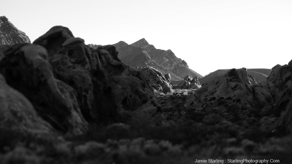 Inspirational black and white image of a mountain landscape, inviting contemplation and self-reflection, guiding viewers on a journey through the nuances of life's emotional spectrum.