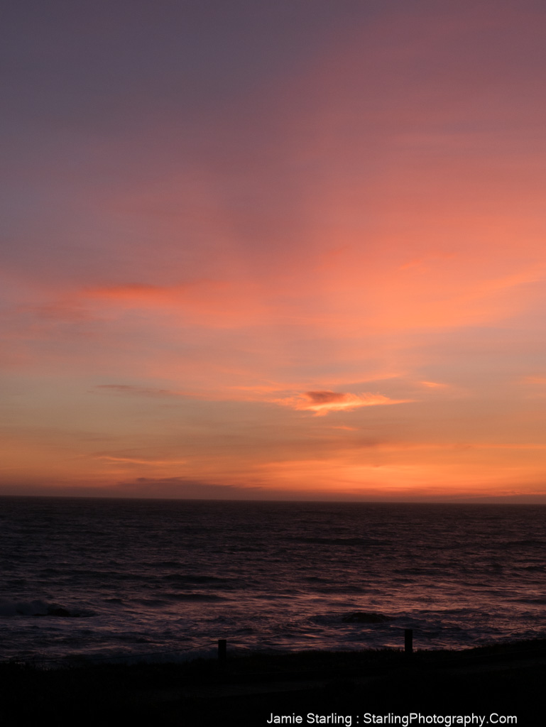 A captivating sunset over the ocean, showcasing vibrant orange and purple hues in the sky, inviting viewers to experience a moment of peace and clarity.