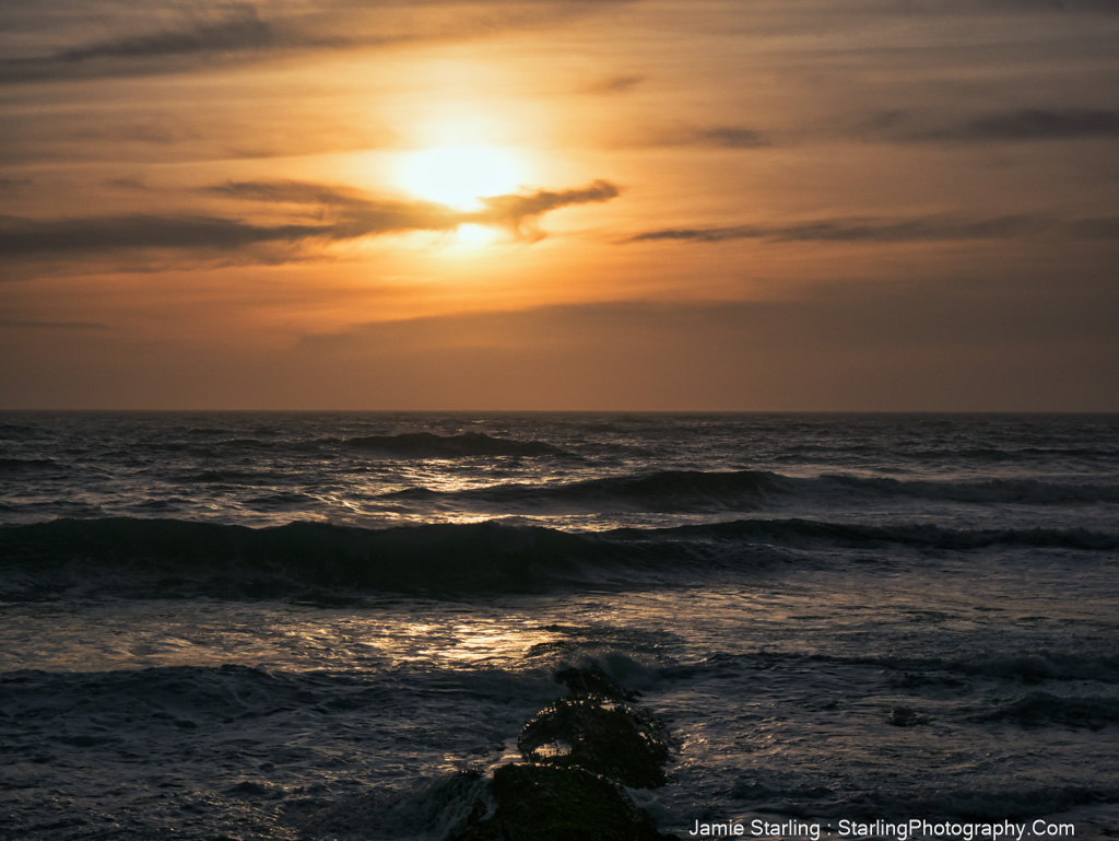 A mesmerizing sunset over the ocean, casting a golden glow on the waves, symbolizing self-discovery and inner peace.