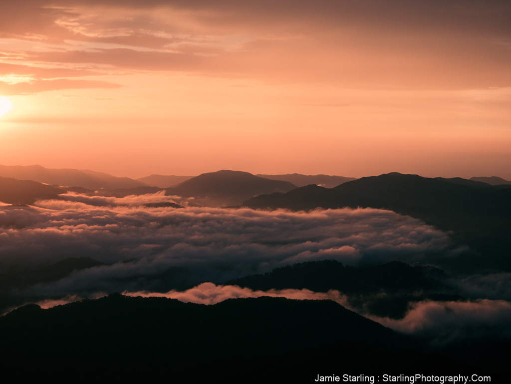 A breathtaking sunset over a sea of clouds, symbolizing confidence, determination, and purpose guiding us through life’s challenges.