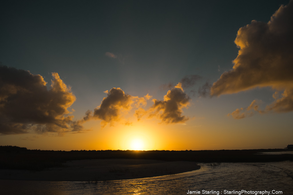 A stunning sunset with golden light shining through clouds, symbolizing how challenges can enhance life's beauty.