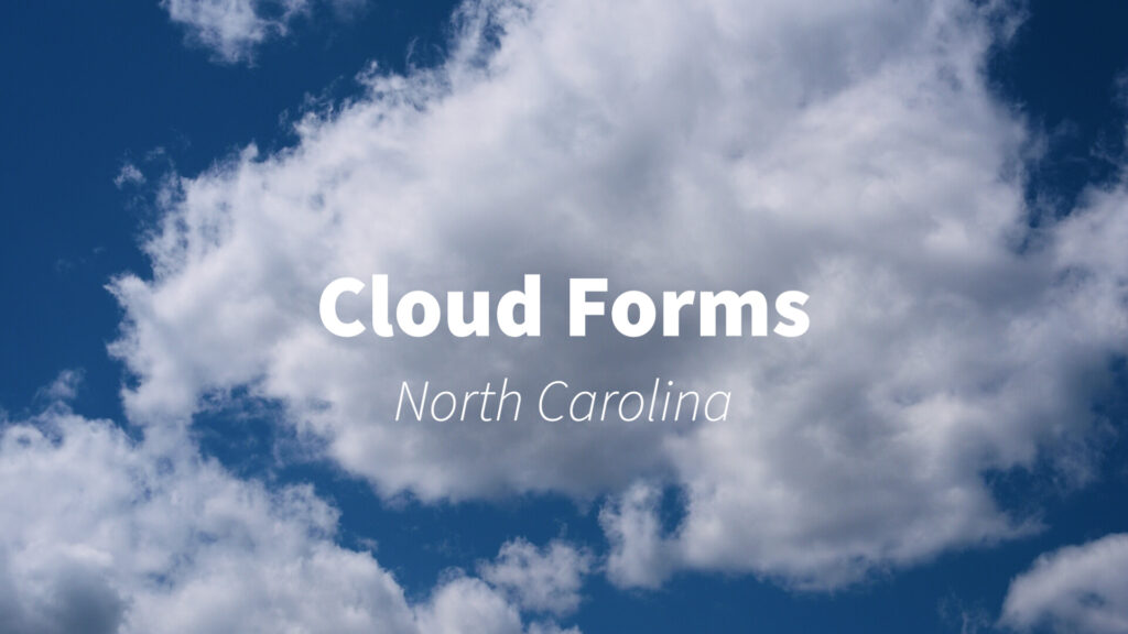 A video of fluffy white clouds against a bright blue sky in North Carolina, highlighting the beauty of cloud formations.