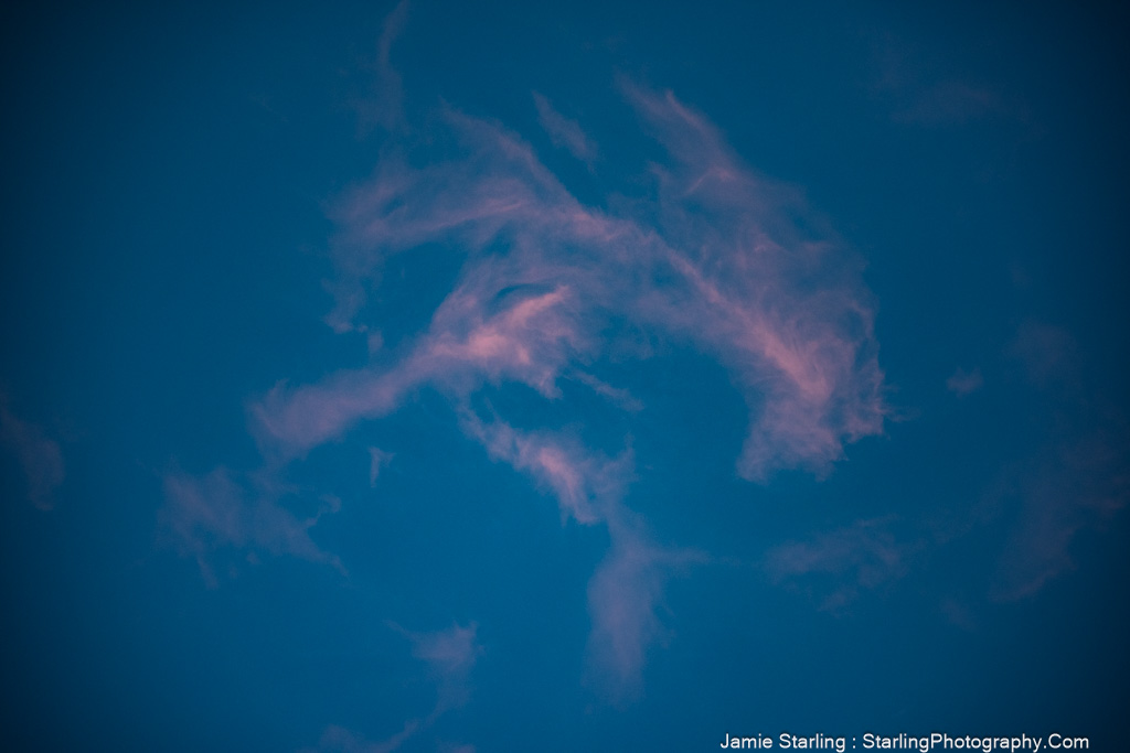 Soft, wispy clouds floating across a calm sky, symbolizing the beauty of change and life’s fleeting moments.